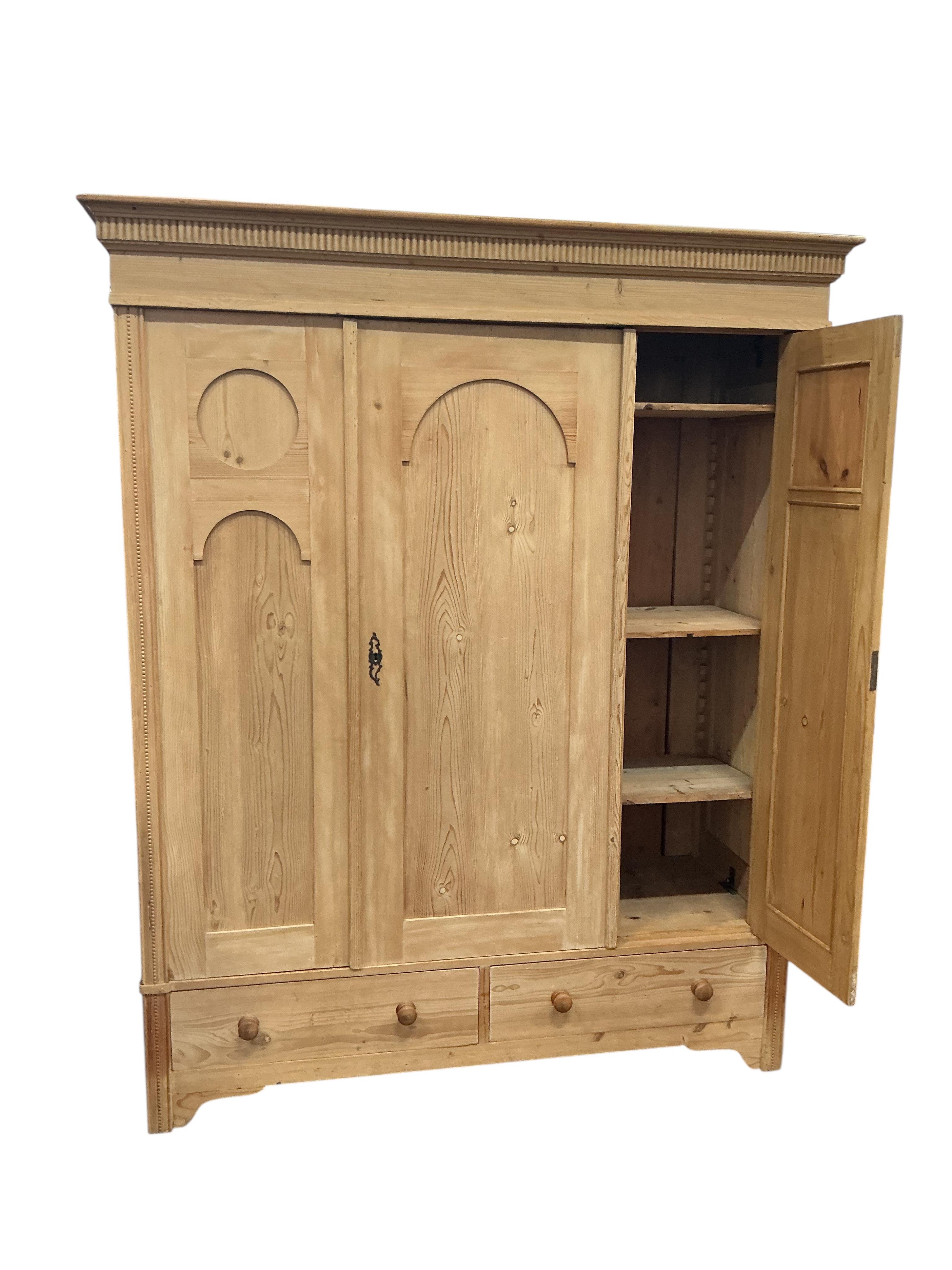 A 19th century Continental pine 'knockdown' triple wardrobe, width 170cm, depth 64cm, height 209cm